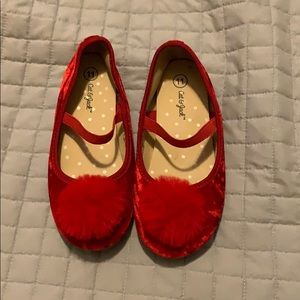 Red, velvet shoes with pompom detail!